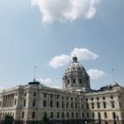 Wide shot of a capitol building during the day.
