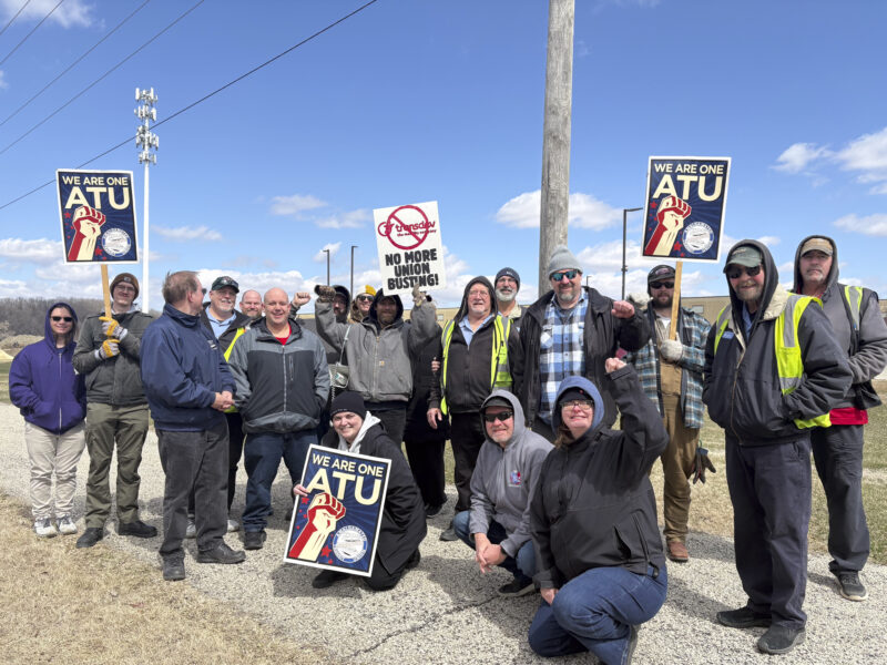 A large group of Rochester Public Transit workers pose for a photo after a march on the boss earlier this year, putting pressure on the employer as a part of a contract campaign.